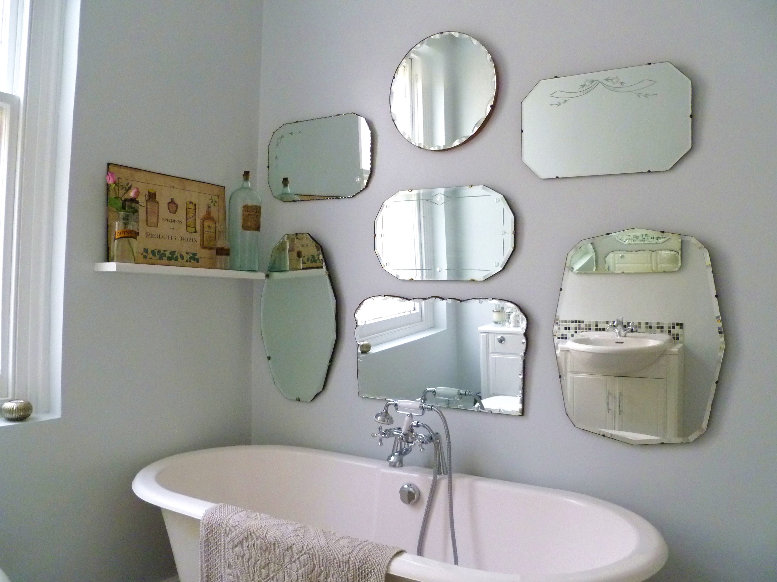 How to hang a display of vintage mirrors Decorator s Notebook