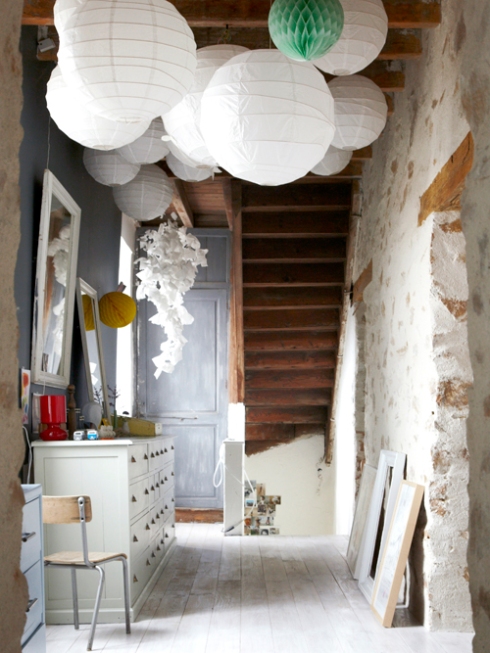 rustic hallway with paper light shades