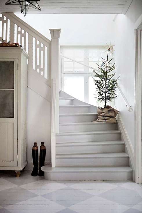 hallway with small Christmas tree